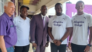 From Left: Former KC Old Boys Association President Mr. Audley Hewett, KC Head Coach Mr. Leaford Grant, KC Principal Mr. Dave Myrie,Co-captains Antwon Walkin and Yourie Lawrence-Clarke at KC&#039;s celebration of their 35th Boys Champs title at their school on Monday.