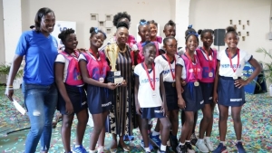 Minister of sport Olivia Grange (fourth left) share a photo opportunity with netball winners Corinaldi Aevenue.