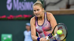 Rogers wins all-American clash as Saville books Halep meeting