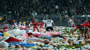 Besiktas throw thousands of toys onto pitch for children who survived earthquakes