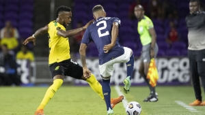 10-man Costa Rica holds off Jamaica Reggae Boyz to top group C