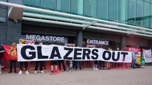 Manchester United fans block megastore entrance in protest against Glazer family