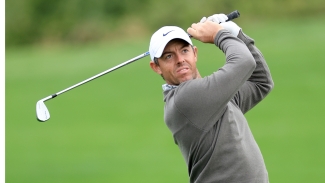 Rivals McIlroy and Reed share the lead in Dubai at the close of delayed round one