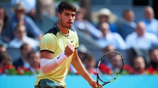 Alcaraz matches Nadal record as reigning champion scrapes into Madrid Open quarters