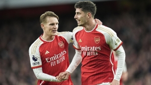 Title-chasing Arsenal go top after seeing off struggling Luton