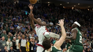Bucks eliminated after more clutch Butler heroics in Heat upset, Warriors claim rare road win