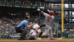 Albert Pujols hits two homers and Yadier Molina pitches the ninth in time-travelling Cardinals win