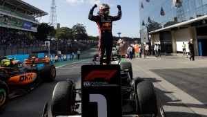 Max Verstappen triumphs at Brazilian GP after narrow escape for Daniel Ricciardo