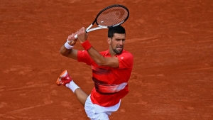 French Open: Djokovic fends off Molcan to reach third round