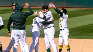 A&#039;s rally to trump World Series champs Dodgers for first win of season, Cain makes history