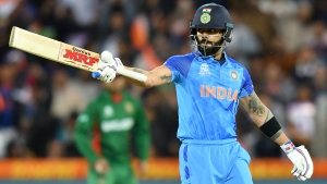 T20 World Cup: Kohli breaks records to guide India to victory over Bangladesh