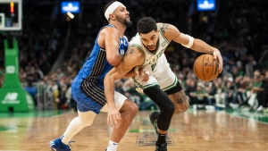NBA-best Celtics beat Magic to improve to 14-0 at home