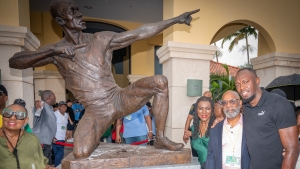Usain Bolt (right) posing in front of the new statue alongside sculptor, Basil Watson, Vice Mayor of Miramar, Alexandria P. Davis, and Jamaica&#039;s Minister of Sport, Olivia &quot;Babsy&quot; Grange.