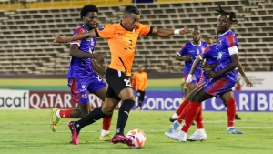 Dunbeholden FC and Cibao FC in action at the National Stadium on Thursday.