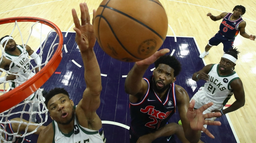 Late Giannis block guides Bucks past 76ers, George leads Clippers comeback on return