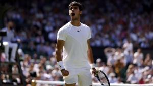 Top seed Carlos Alcaraz battles into third round at Wimbledon