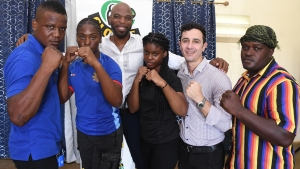 Jamaica Boxing Association president Stephen Bomber Jones (third left) and national coach Felipe Sanchez (second right)), share a photo opportunity with boxers (from left) Ian Darby, Shanika Gordon, Sherikee Moore and Fabian Tucker.