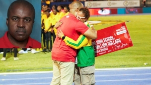 Grace Food Domestic CEO Frank James hugs a tearful Mrs Collette Pryce, Principal of St Jago High at Kingston&#039;s National Stadium on Saturday after the company donated JMD$ 1 million to a legacy project in honour of the late journalist, track and field analyst and author Hubert Lawrence, who died suddenly on February 23, at the age of 63.