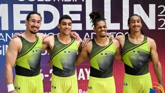Michael Reid (second right) share a photo opportunity with Jamaican teammates (from left) Caleb Faulk, Matthew McClymont and Elel Wahrmann-Baker at the Pan American Artistic Gymnastics Championships in Medellin, Colombia recently.