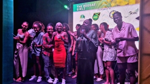 Minister of sport Olivia &quot;Babsy&quot; Grange address the gathering, while sharing a light moment with the Reggae Girlz during a sendoff event at the Summit House on Tuesday