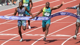 Christian Coleman celebrates after crossing the line ahead of Noah Lyles in the men&#039;s 100m in Eugene on Saturday.