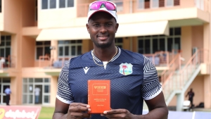 Jason Holder shows off his special edition prize.