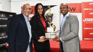 President of MCOBA Victor Tomlinson (left) and Tournament Manager of the MCOBA/Lindy Delapenha Golf Classic Telroy Morgan (right) flank title sponsor representatives Nicole Touzalin the Operating Principal at Keller Williams Realty Jamaica at the launch of the MCOBA/Lindy Delapenha Golf Classic at the office of Keller Williams Realty on Wednesday.   