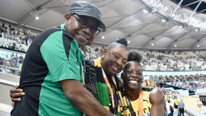 Jamaican sprinter, Shericka Jackson (right) is congratulated by the Minister of Culture, Gender, Entertainment and Sport, the Honourable Olivia Grange (centre) and the Minister of Tourism, the Honourable Edmund Bartlett (left) after setting a new championship record of 21.41 to win the women&#039;s 200m final at the World Athletics Championships in Budapest, Hungary on Friday.