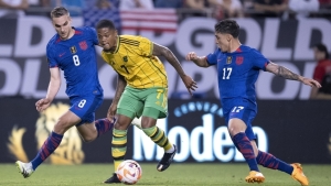 Jamaica&#039;s Leon Bailey tries to escape the attention of United States duo James Sands (left) and Alejandro Zendejas during their Gold Cup Group A opening fixture at Soldier Field in Chicago on Saturday