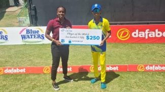 Trishan Holder collecting her player of the match cheque from former West Indies Women fast bowler Shakera Selman.
