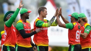 Guyana Amazon Warriors celebrate a wicket.