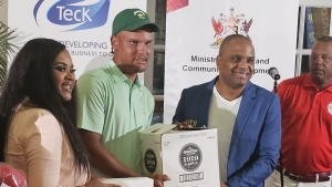 Zandre Roye (2nd L) was presented with the champion prize by Trinidad &amp; Tobago&#039;s sports minister Ms. Shamfa Cudjoe (L) and Mr. Shakka Subero (2ndR) who represented sponsor National Lotteries and Control Board, while Wayne Baptiste (R) president of the Trinidad &amp; Tobago Golf Association looked on. The Trinidad &amp; Tobago Open Golf Championship was played at the Tobago Plantation Golf Course in the twin island. It ended on Sunday with Roye winning the championship (first time for a Jamaican) and Jamaica winning the President&#039;s Cup.   